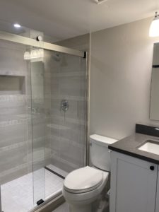 Modern standing shower next to toilet