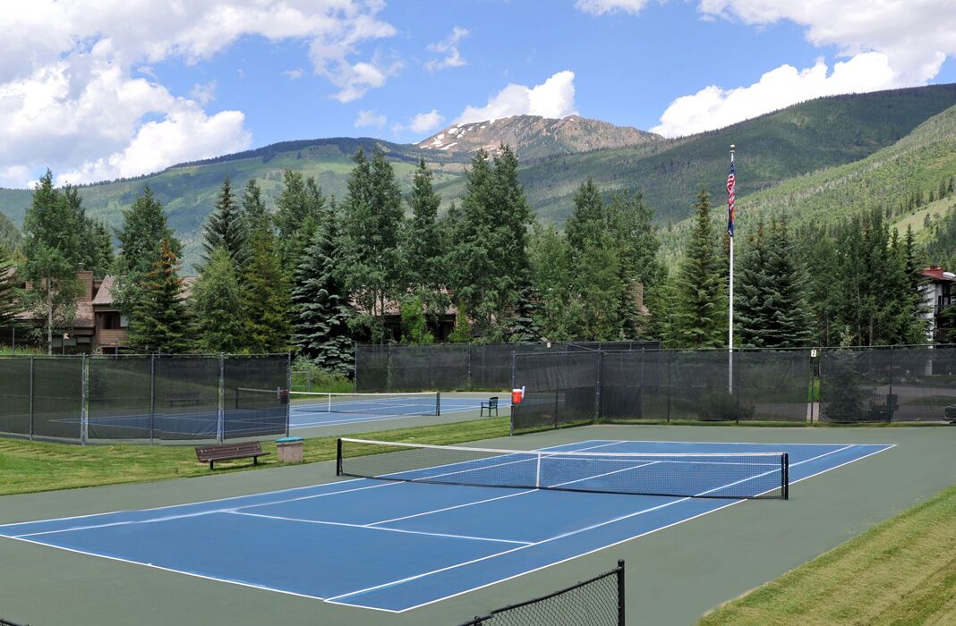 Vail Racquet Club tennis court with mountains in background