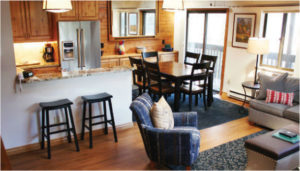Vacation Rental Living room with full kitchen and dining area