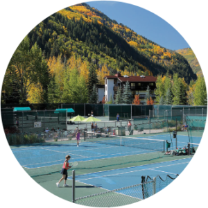 People playing tennis near Gore Range mountain