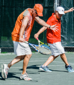 Two people preparing to play tennis