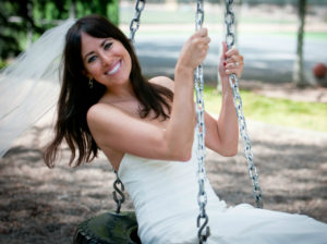 Bride smiling on tire swing