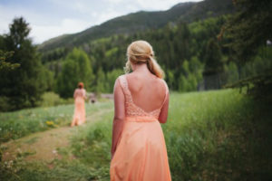 Bridesmaids walking in meadow