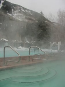 Steam rising in air from warm hot tub